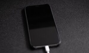 iPhone with charger plugged in