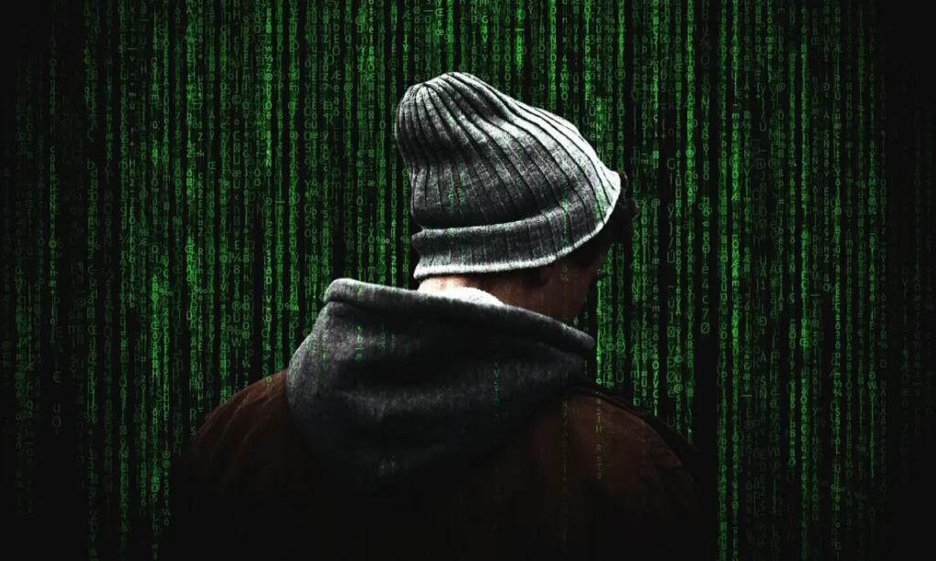 Ethical hacker working on a laptop