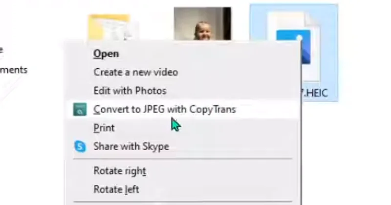 A Windows right-click context menu showing the "Convert to JPEG with CopyTrans" option for an HEIC file.