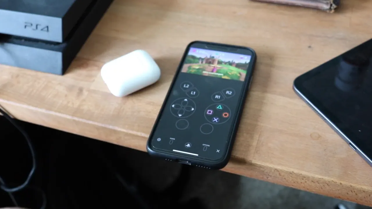 Remote Play App opened on mobile and Airpods case placed next to it.