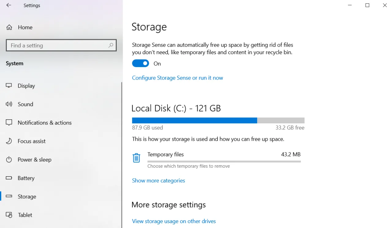 Enabled Storage Sense in Windows Settings.