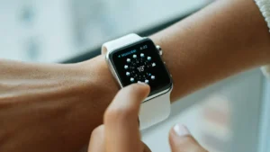 Unpair or Reset Apple Watch - Person wearing aluminium case Apple Watch with white sports band.