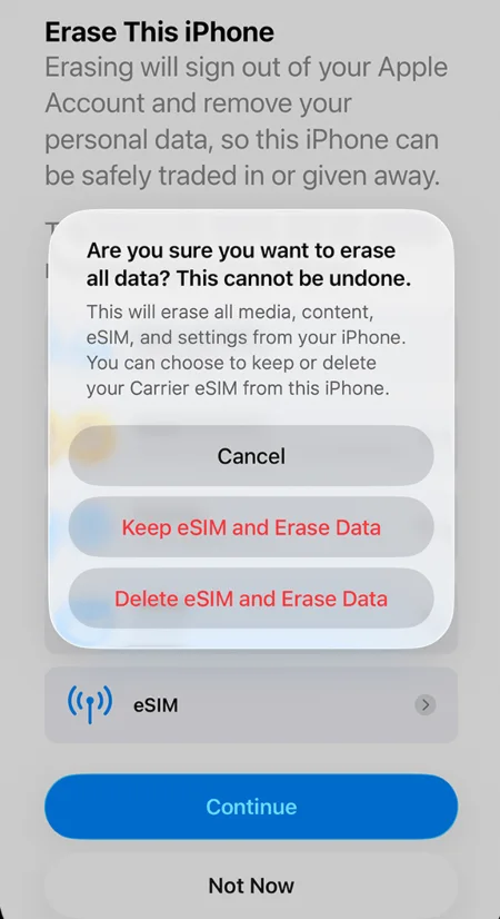 iPhone ‘Erase This iPhone’ screen showing a confirmation pop-up asking whether to keep or delete the eSIM while erasing all data.