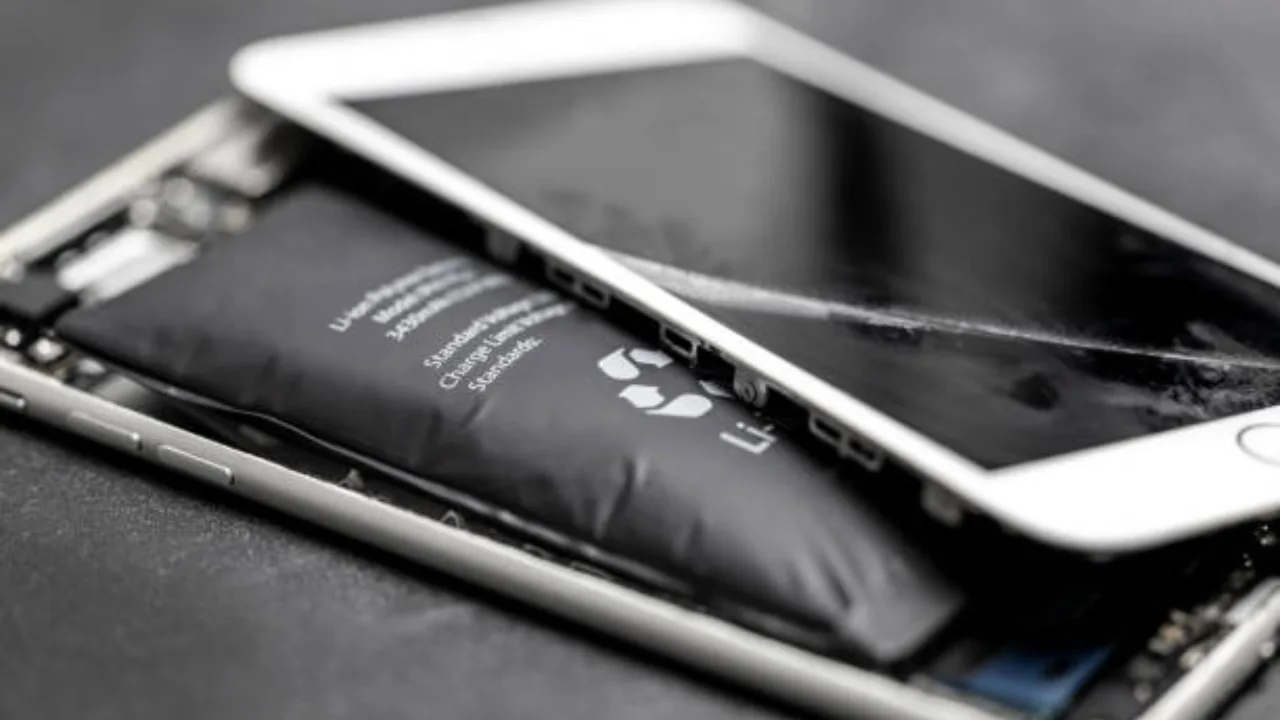 Android smartphone with visibly bulging back cover and screen-to-frame gap.