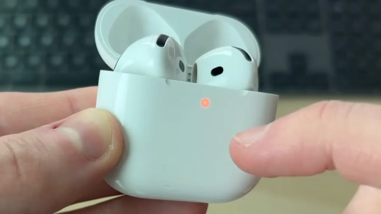 AirPods front flash glowing orange during reset.